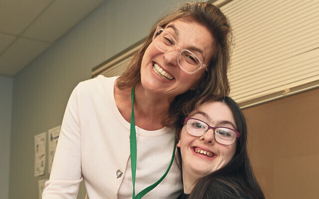 Ilana Picker, the new director of Sinai at Ma’ayanot, shares a smile with a student. (Sinai Schools)