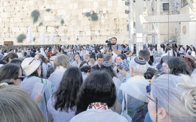 Thousands of protesters gathered around non-Orthodox women, including a bat mitzvah girl and her family, at the Western Wall on July 29, 2022.
(Noga Tarnopolsky)