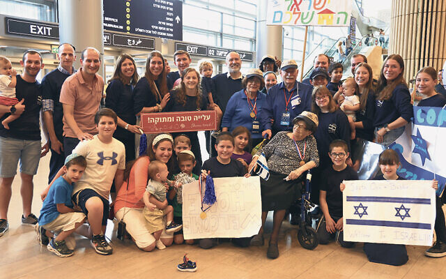 Stella Rockoff, seated, front right, with her family in Israel. (Shai Getsoff)