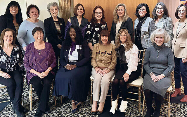 Back row, from left, Rachel Coalition committee members Sheri Wolfson of New York City and Sandra Rosenbaum of Short Hills, luncheon co-chair Lois Kaish of Springfield, Rachel Coalition chair Robin Polson of Maplewood, luncheon co-chair Ronnie Senior of West Orange, Rachel Coalition committee members Debbie Stein of Denville and Carol Nelson of Montville, and Rachel Coalition Outreach Committee co-chairs Lisa Lindauer and Terri Friedman, both of Livingston. From, from left: Pamela Fishman of Short Hills, the immediate past chair of the Rachel Coalition; Diane K. Squadron, PsyD, CEO of JFS; speaker Katrina Brownlee; Thelma Florin of West Orange; Andrea G. Bier of West Orange, president of the JFS board of trustees; and luncheon co-chair Lynn Gruber of Short Hills. (Courtesy JFS MetroWest)