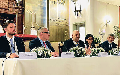 Michael Wildes, second from left, is part of a panel at the mayors’ summit in Athens.