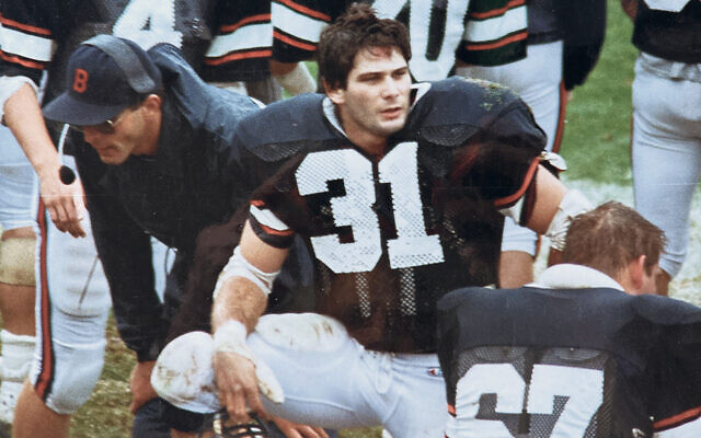 Steven Weiss sits intently on the sidelines during a Bucknell University football game. (Courtesy Gail Lazarus)