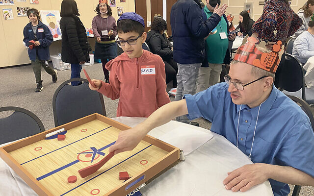 JSDD participants and volunteers enjoy Purim games.(Courtesy JSDD)