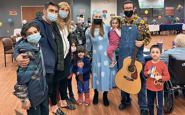 The Shteingart and Huttel families mark Purim with residents of Daughters of Israel in West Orange. (Courtesy JFSCNJ)