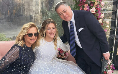 Gail and Jeremy Fingerman are with their daughter, Esther, during Kabbalat Panim.