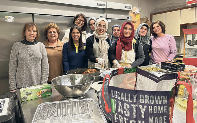 Muslim and Jewish women prepare food for the iftar at Shomrei Torah in Wayne. (Shomrei Torah)
