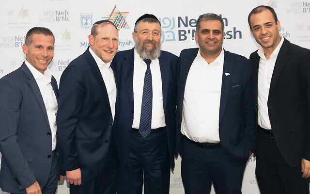 Zev Gershinsky, left, NBN’s executive vice president; Rabbi Yehoshua Fass, NBN’s co-founder and executive director; Minister Rabbi Yoav 
Ben-Tzur, MK Ofir Sofer, and Director-General Avichai Kahana.