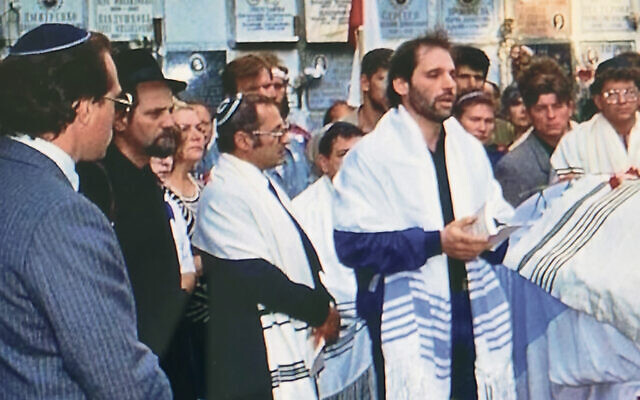 In 1991, Alexander Smukler, at left in suit, and Rabbi Zinovy Kogan, the short man in the dark-striped talit, are at the funeral of Ilya Kritchevsky.
