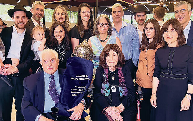 Philip and Shirley Levitan are surrounded by their three sons, daughters-in-law, grandchildren, and great-grandchildren.