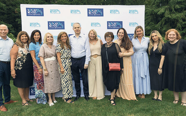 Leaders and supporters gather at the Israel Bonds National Women’s Division program on July 12 in South Orange, including Cathy Distelburger, in beige, center. (Photos courtesy MDA Human Milk Bank)