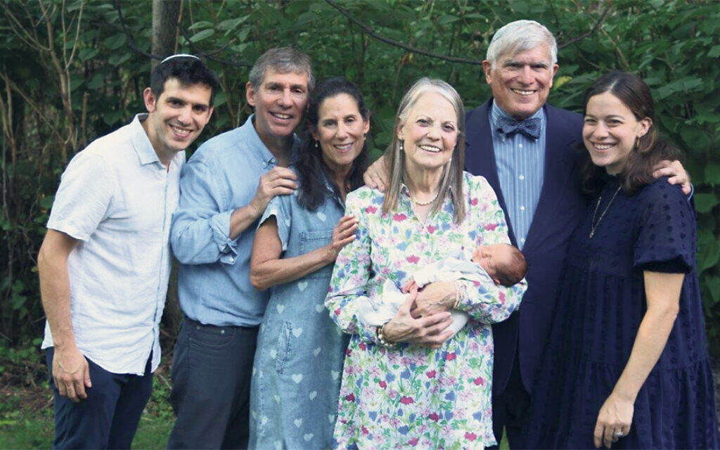 Three generations — from left, baby Devin’s father, Allen Glenn; his paternal grandparents, Ray and Marla Glenn; his maternal grandmother, Sharon Penkower Kaplan, holding him; his maternal grandfather, Joseph Kaplan; and his mother, Gabrielle Glenn. Aiden Glenn is not in the picture; he was off having fun, elsewhere in the backyard.