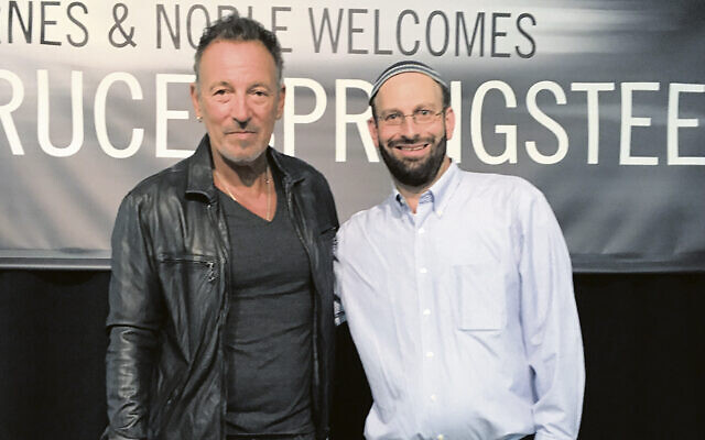 Rabbi David Kalb looks thrilled to be standing next to Bruce Springsteen.