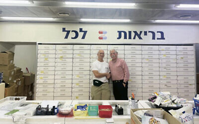 Jeff Stark, left, stands next to Moshe Cohen, CEO of Yad Sarah.