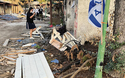 This is a street in the ruined Kibbutz Kfar Aza. (Courtesy Michael Schlank)