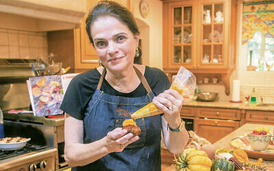 Judy Elbaum cooks in her kitchen.