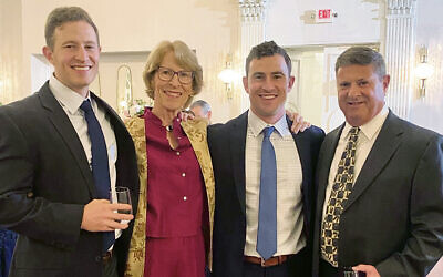 Susan FitzGibbon, dressed in a modest pants outfit, enjoys the wedding reception with her family. Susan FitzGibbon, dressed in a modest pants outfit, enjoys the wedding reception with her family.