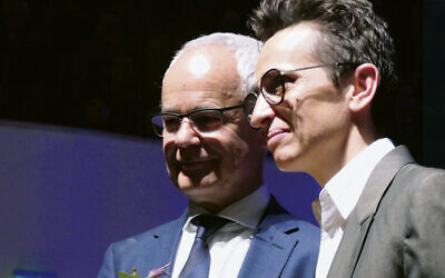 Masha Gessen, right, with Heinrich Riethmüller, who presented them with the Leipzig Book Prize for European Understanding in 2019, at the Leipzig Book Fair. (Wikimedia Commons)