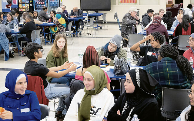 A youth-led interfaith dialogue is held at Teaneck High School to discuss the Middle East on November 5, 2023. (Aristide Economopoulos for The Washington Post via Getty Images)