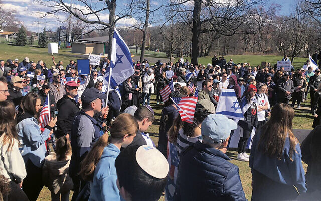 Members of the Jewish community gather in Votee Park in Teaneck on Sunday.