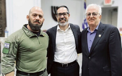 Major Sagi Dovev, Rabbi Joshua Hess of Young Israel of East Brunswick, and Howard Gases, the director of FIDF NJ, are at a Yom HaZikaron program in East Brunswick. (Courtesy FIDF)