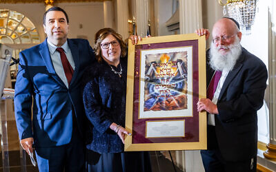 Rabbi Asher Herson with Stuart and Robin Kwestel