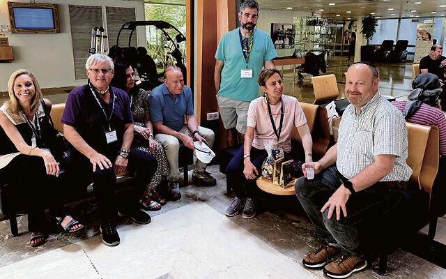 Members of Temple Har Shalom meet with David Brief in Sheba Medical Center’s lobby in July 2024. Yona was still alive then. Members of Temple Har Shalom meet with David Brief in Sheba Medical Center’s lobby in July 2024. Yona was still alive then.