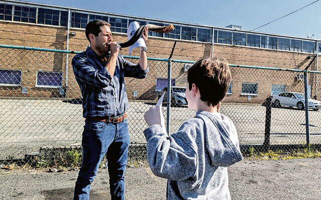 Rabbi Jesse Olitzky blows a shofar outside the Elizabeth Contract Detention Center. Rabbi Jesse Olitzky blows a shofar outside the Elizabeth Contract Detention Center.