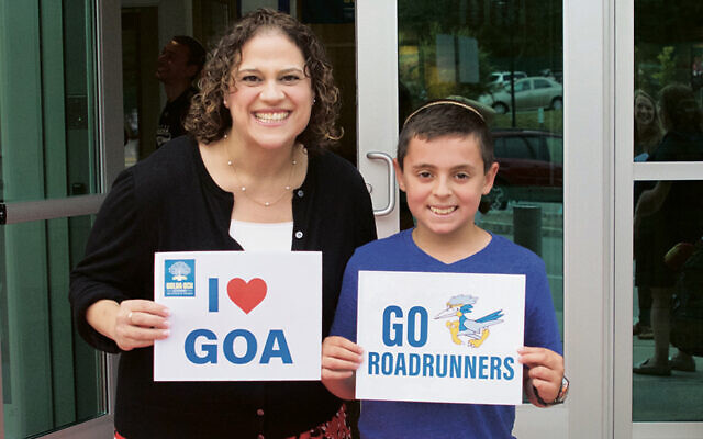 ON THE COVER: A few years ago, Carrie Siegel and her son, Zach, stand outside GOA. (GOA)