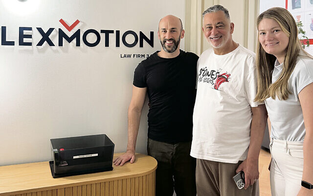 ON THE COVER: Jeremy Lentz worked with the Lexmotion law firm in Krakow to get his Polish citizenship. Here, Mr. Lentz is in the firm’s office with his friend Oussama Bouaboura and attorney Tatiana Oleksak.