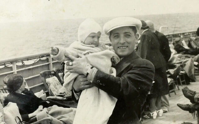 Eva Wiener is in her father’s arms onboard the MS St. Louis in May 1939. Eva Wiener is in her father’s arms onboard the MS St. Louis in May 1939.