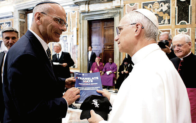 In the Vatican, Rabbi Noam Marans gives Pope Leo XIV a copy of AJC’s “Translate Hate” and a White Sox cap.