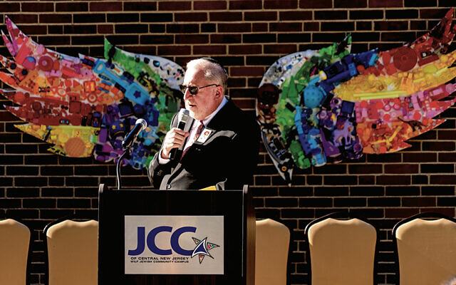 Rabbi Paul Kerbel of Temple Beth El Mekor Chaim in Cranford welcomes the community to the commemoration at the JCC in Scotch Plains.