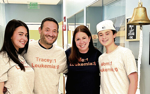 Ashley, Jason, Tracey, and Reid Hoberman celebrate Tracey ringing the bell at Morristown Medical Center after completing her cancer treatment on October 3, 2025.
