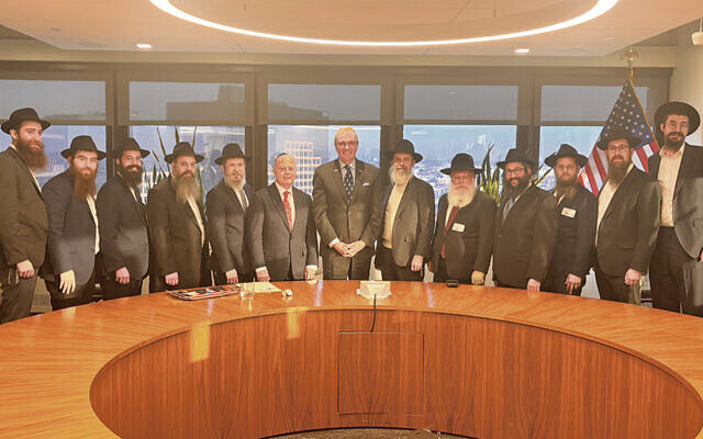New Jersey Governor Phil Murphy, center, with, from left, Rabbi Avrohom Minsky of Chabad of Newark; Rabbi Isser Brickman of Chabad West Cherry Hill; Rabbi Shmuel Naparstak of Chabad of Jackson; Rabbi Chaim Schapiro, dean of students at the Rabbinical College of America; Rabbi Levi Grossbaum of Chabad of Livingston; Miles Berger, a trustee of the Rabbinical College of America; Rabbi Mendy Herson, dean of the Rabbinical College of America and director of Chabad of New Jersey; Rabbi Asher Herson of Chabad of Northwest NJ; Rabbi Avi Richler of Chabad of Mullica Hill; Rabbi Yaakov Chaiton of Chabad of Robbinsville; Rabbi Yitzchak Lerman of Chabad of South Bergen County, and Rabbi Mendy Kaminker of Chabad of Hackensack.