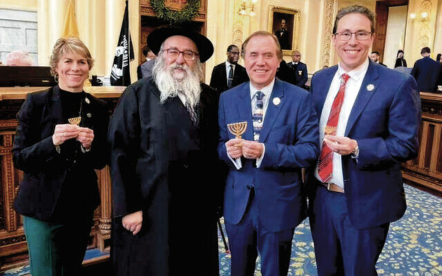 Assemblywoman Lisa Swain (D-38), Rabbi Mordechai Kanelsky, Assembly Speaker Craig Coughlin (D-19), and Assemblyman Chris Tully (D-38) Assemblywoman Lisa Swain (D-38), Rabbi Mordechai Kanelsky, Assembly Speaker Craig Coughlin (D-19), and Assemblyman Chris Tully (D-38)