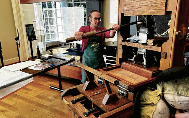 ON THE COVER: Dr. Noam Sienna prints using a model of an 18th-century wooden “common press” at the University of Virginia.