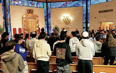The teens stood in the sanctuary to welcome Eli Sharabi. (Hope White of TAPinto Montville)