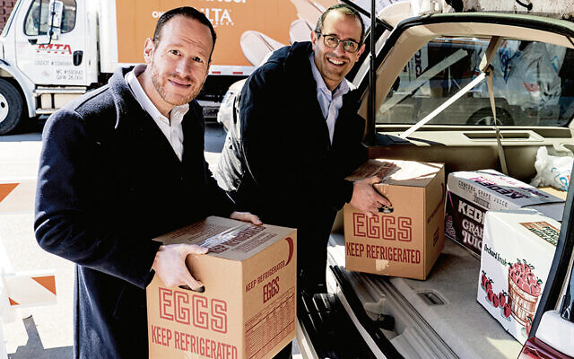 Met Council CEO David Greenfield, left, and Deb El Food Products vice president Michael Gibber (Courtesy Met Council)