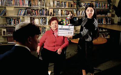 Students film survivor Fira Kaplansky.