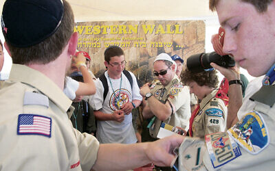 ABOUT THE COVER: Jewish Scouts stand in front of a poster of the Kotel in Jerusalem. (Courtesy of Alan Smason)