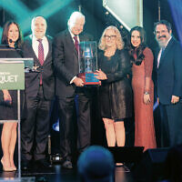 From left: Lisa and Dan Serviss, Barry Mandelbaum, Cheryl Burstein, and Toba and Rabbi Zalman Grossbaum. Mr. Mandelbaum, chair of Mandelbaum Barrett PC, and Ms. Burstein, its COO, accepted the award on behalf of the firm.
