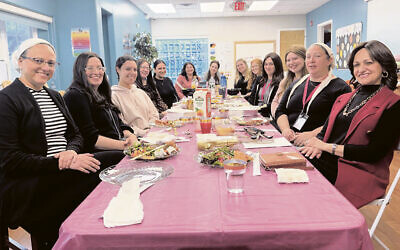 Rebbetzin Shterney Kanelsky, front right, with Ladies CYM staff. (Courtesy Bris Avrohom)