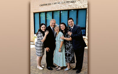 In honor of Cantor Caplan’s retirement, the courtyard outside the synagogue’s Werb Chapel was named in his honor. With him and his wife, Nancy, are their three children, from left, Tamar, Simona, and Ilan.