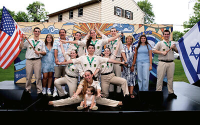 Tzofim Friendship Caravan with Muss alumnae Hannah Kirshenbaum left, Maya Klein, right, both wearing light blue, and Russell and Marci Robinson (Robert Schneider)
