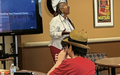 Crystal Moon-Boulware, Columbia Bank’s Community Development vice president, with seniors at Jewish Federation Plaza (Courtesy CFI)