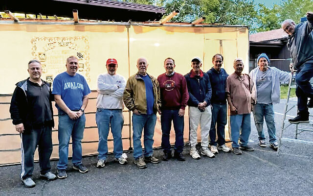The sukkah-building team at B’nai Israel