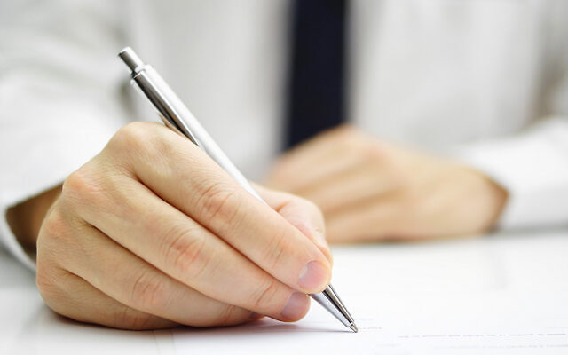 businessman is signing agreement