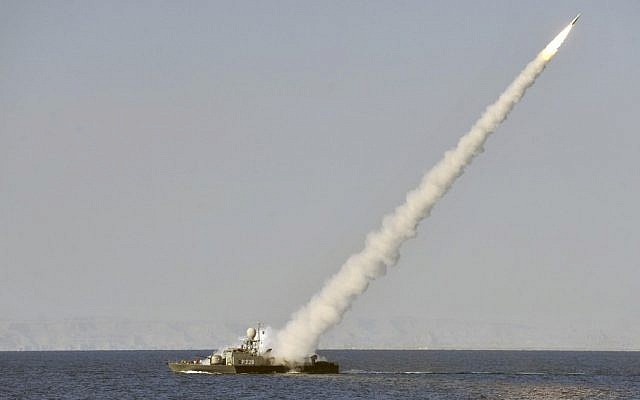 Illustrative: An Iranian navy vessel launches a missile during a drill in the Sea of Oman, in January 2012. (AP/ISNA, Amir Kholousi)