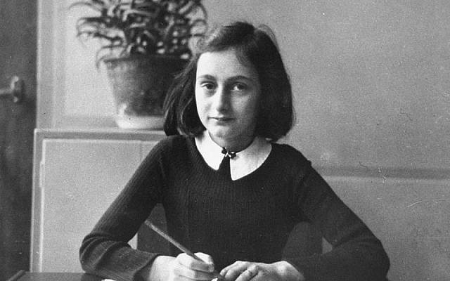 Anne Frank, age twelve, at her school desk in Amsterdam, 1941.