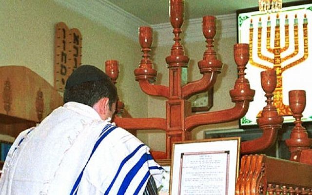 Illustrative: An Iranian Jew prays in a synagogue in Shiraz, Iran. (Public domain/Creative commons)
